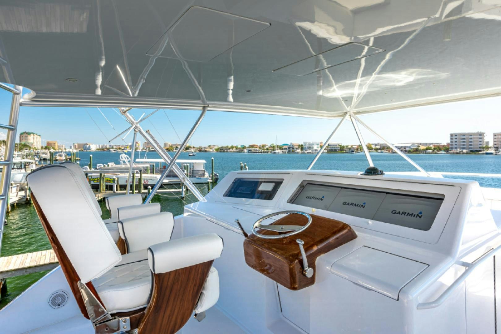 a boat with a seat and a steering wheel on the front aboard MISS PAULA V Yacht for Sale