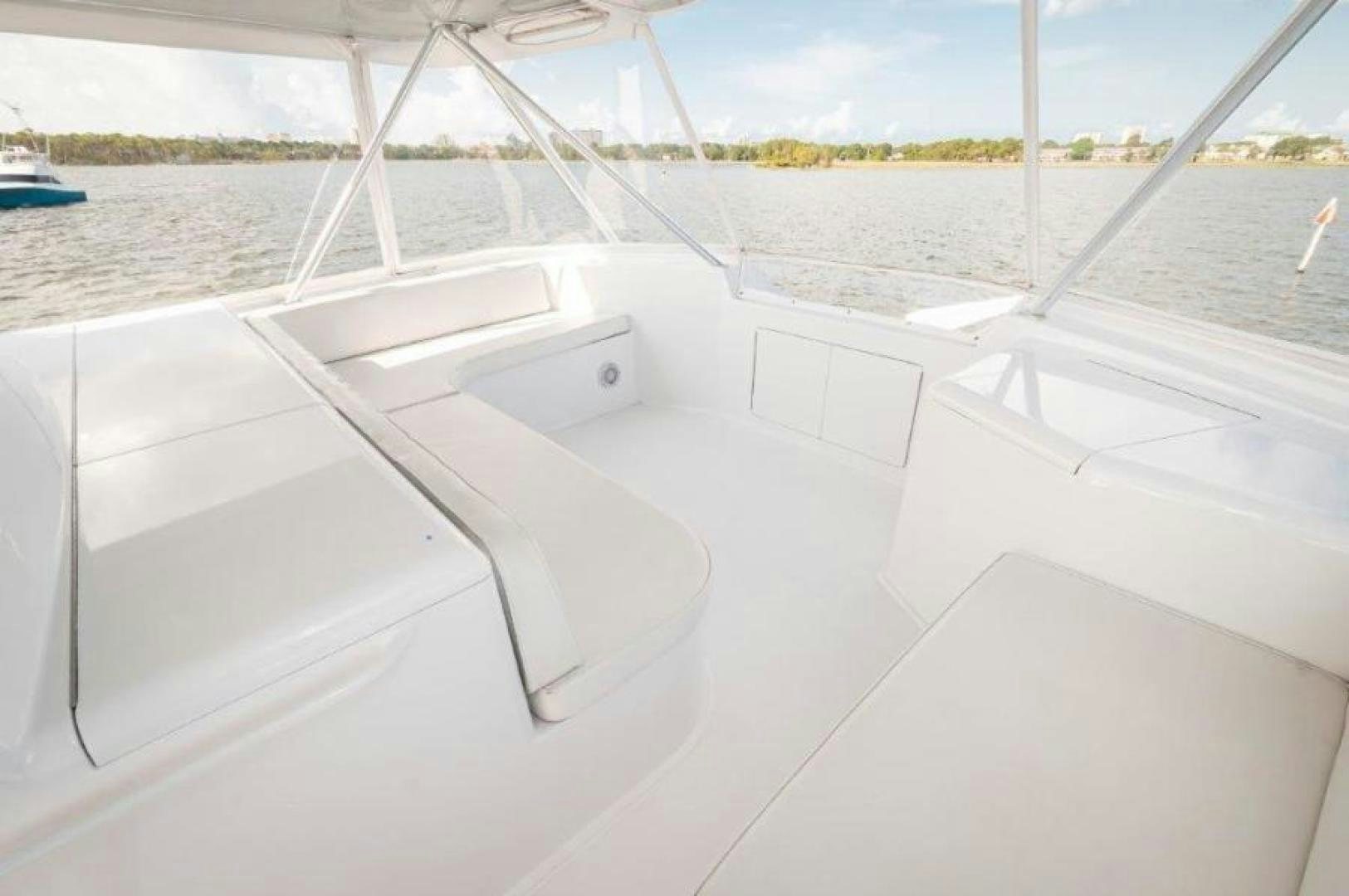 a white boat on a body of water aboard MISS PAULA V Yacht for Sale