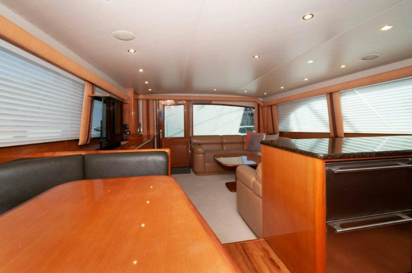 a living room with a couch and a table aboard MISS PAULA V Yacht for Sale