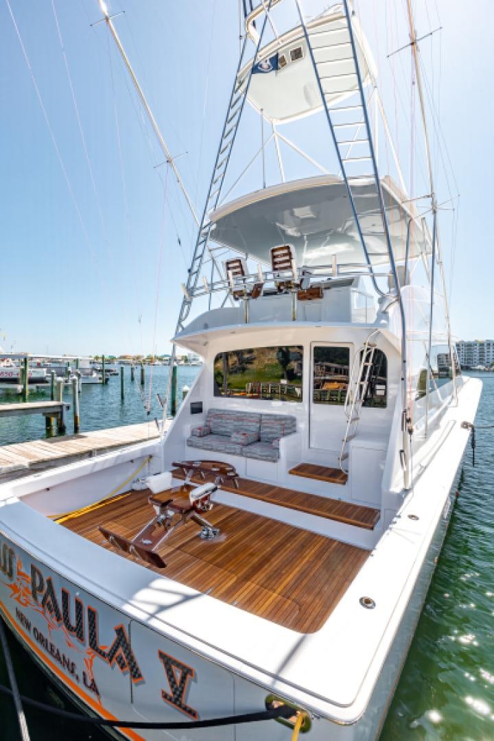 a boat docked at a pier aboard MISS PAULA V Yacht for Sale