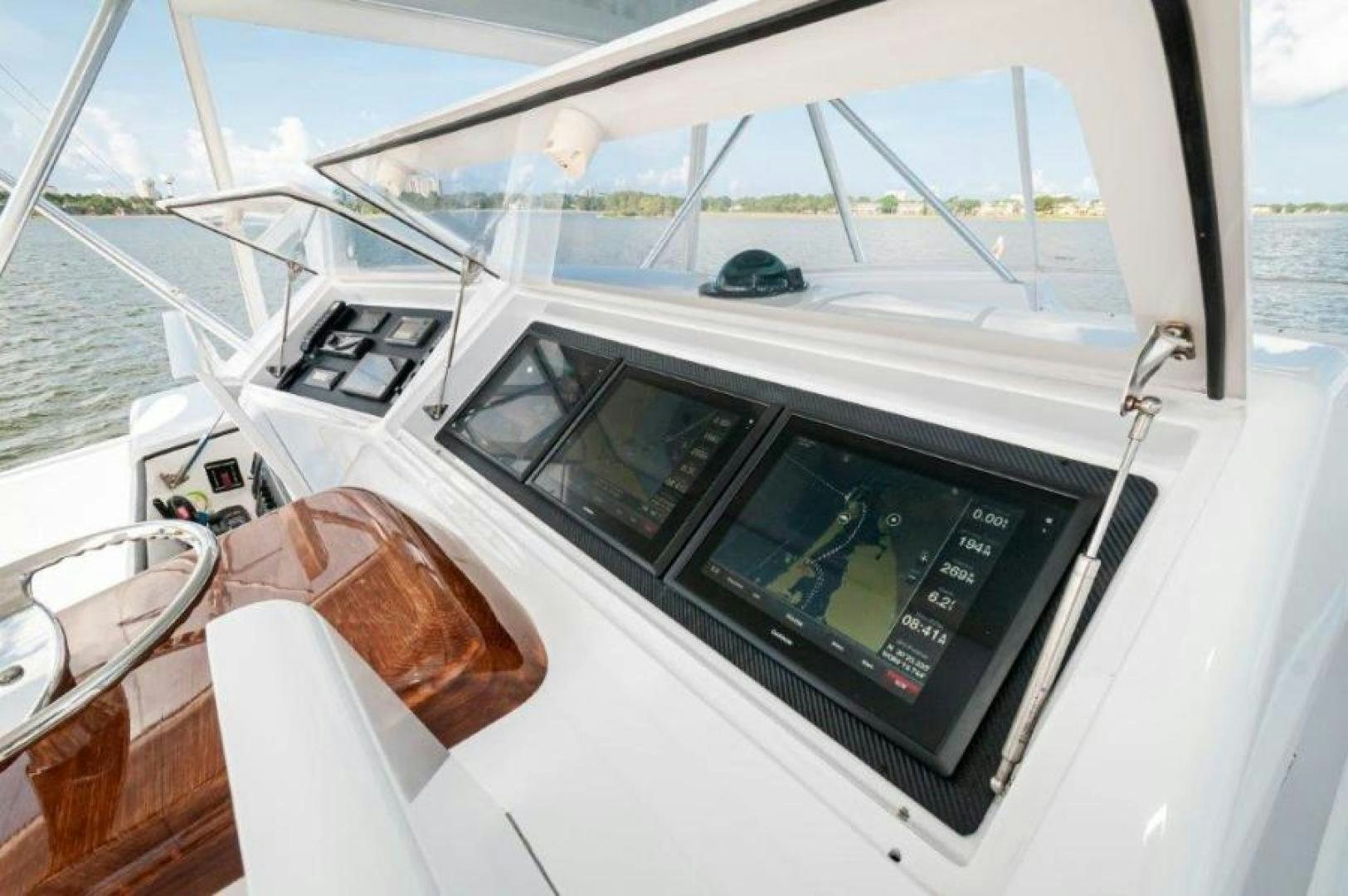 a white car with a screen aboard MISS PAULA V Yacht for Sale