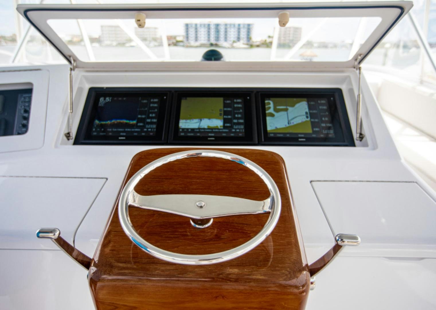 a white machine with a white panel and a wooden panel aboard MISS PAULA V Yacht for Sale