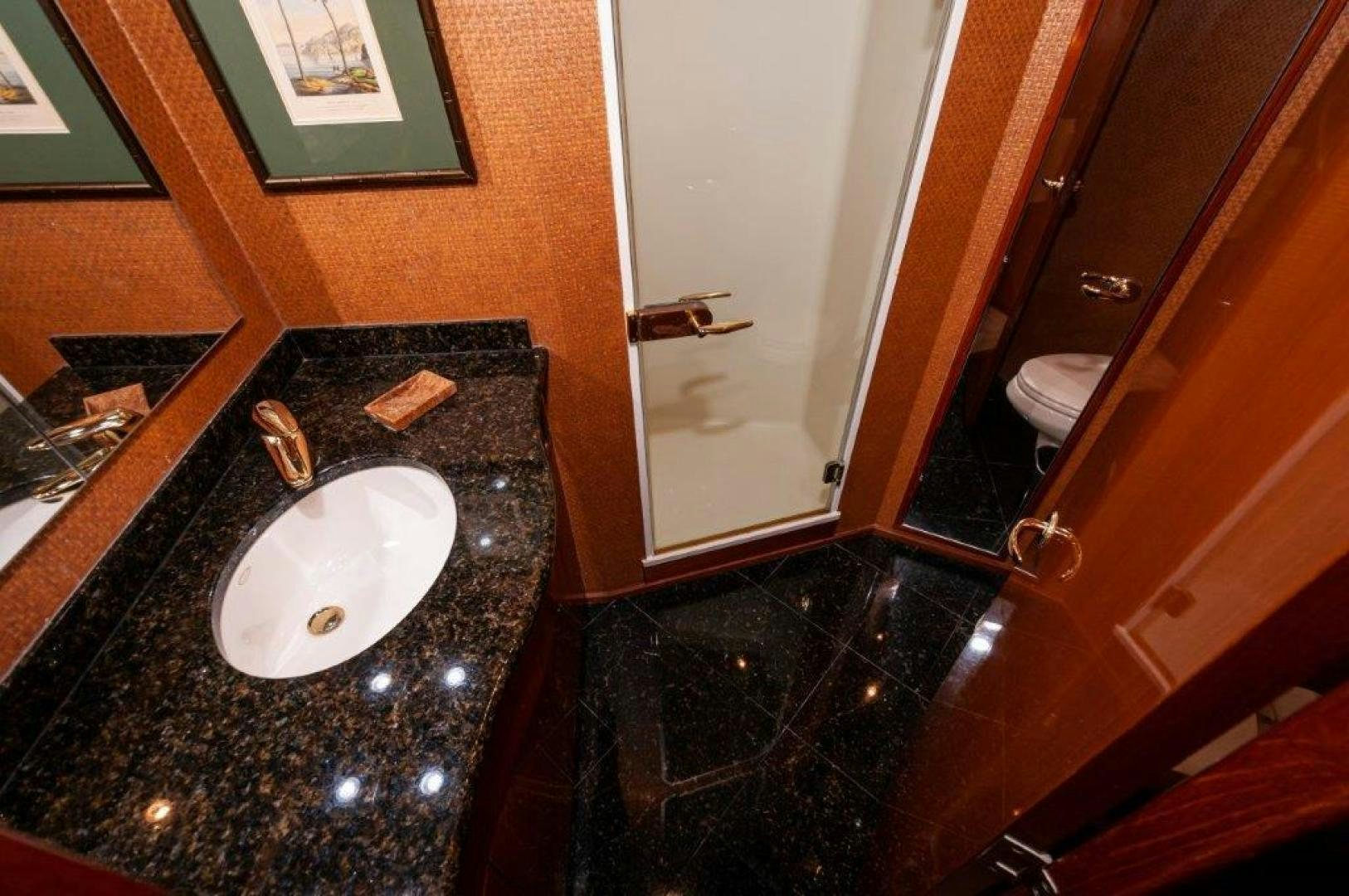 a bathroom with a sink and a mirror aboard MISS PAULA V Yacht for Sale
