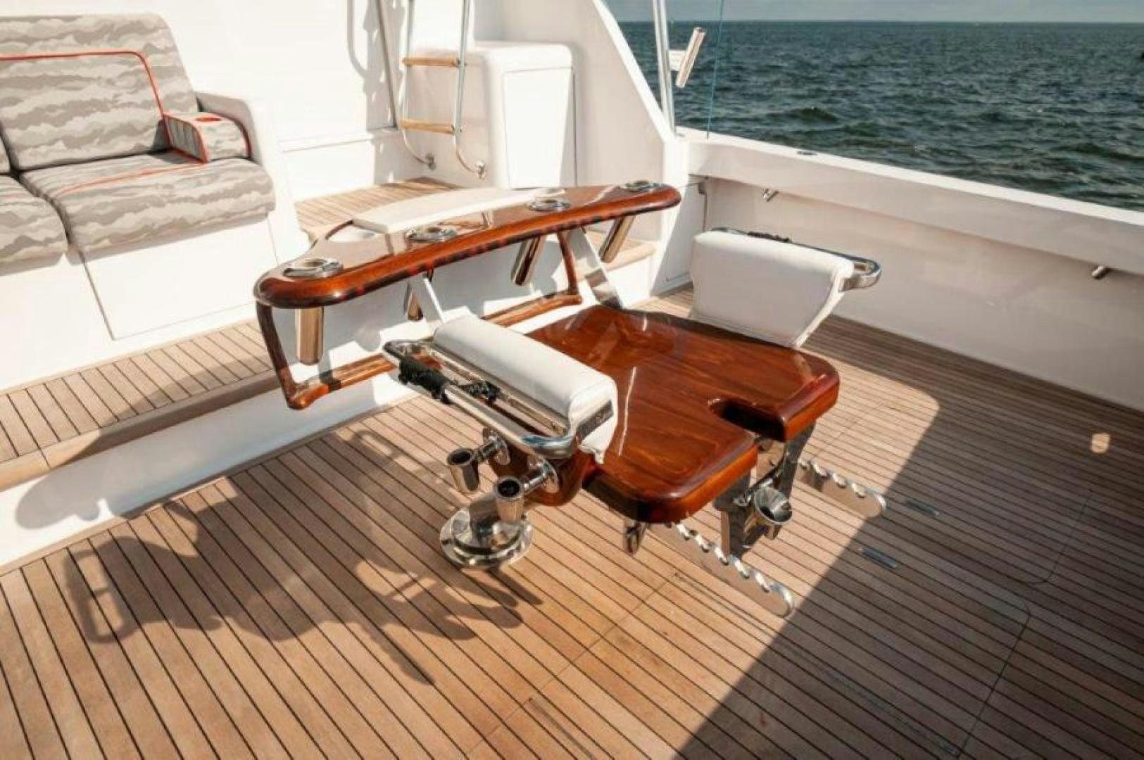 a wooden boat on a deck aboard MISS PAULA V Yacht for Sale