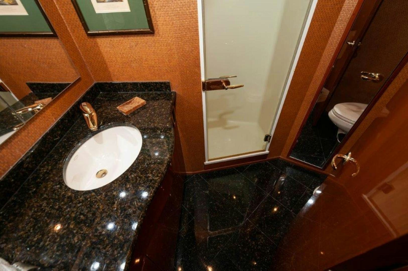 a bathroom with a sink and a mirror aboard MISS PAULA V Yacht for Sale