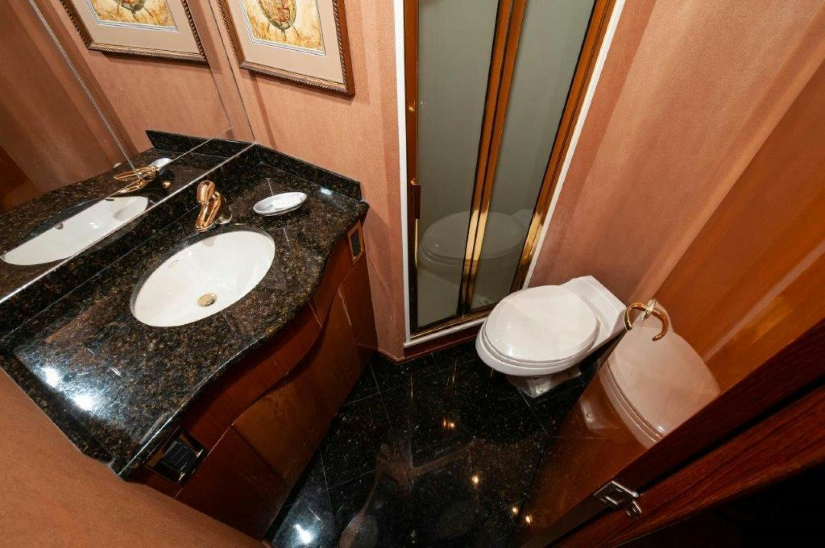 a bathroom with a sink and a mirror aboard MISS PAULA V Yacht for Sale
