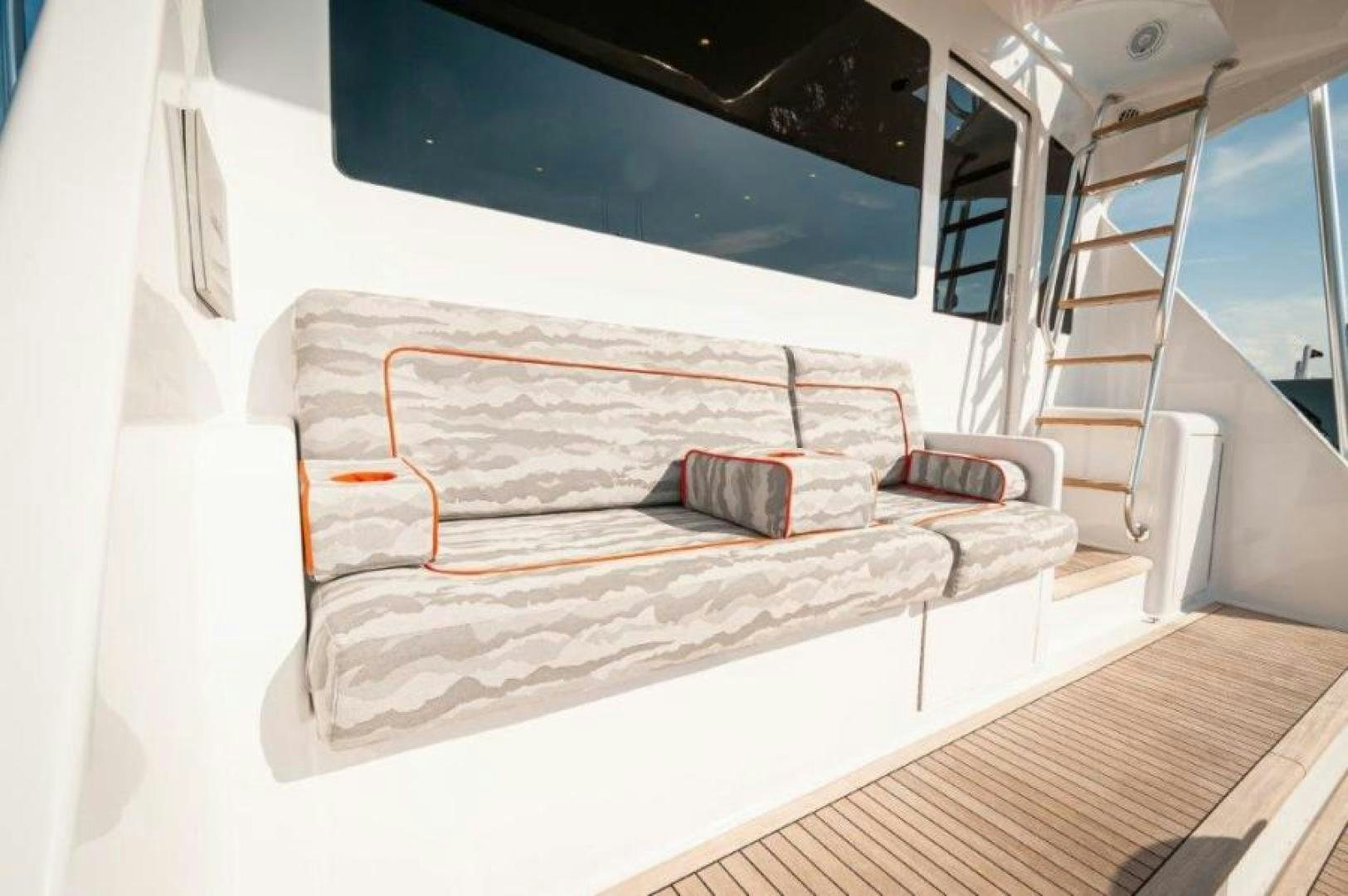 a bed with a white cover aboard MISS PAULA V Yacht for Sale