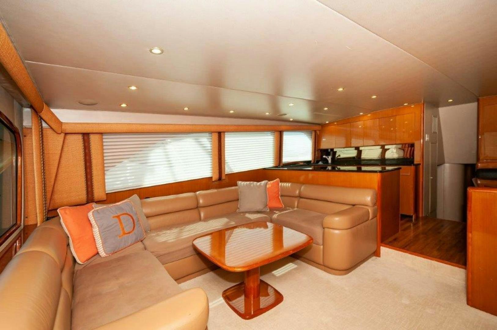a living room with a couch and a table aboard MISS PAULA V Yacht for Sale