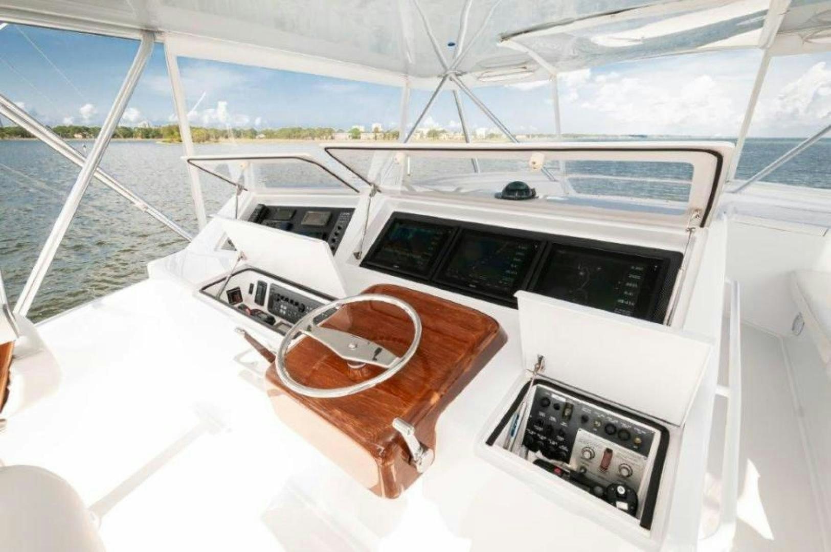 a boat with a steering wheel aboard MISS PAULA V Yacht for Sale