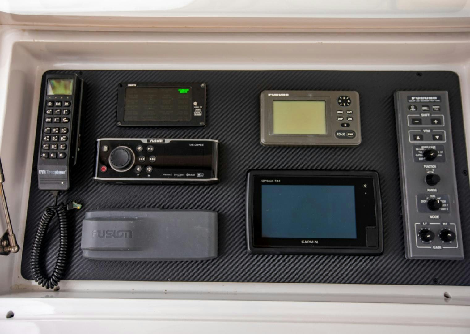 a black electronic device aboard MISS PAULA V Yacht for Sale