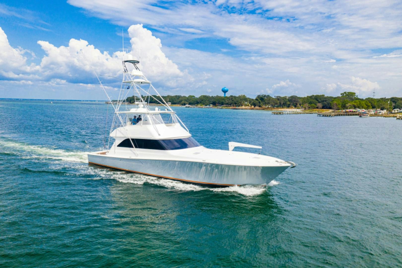 a white boat on the water aboard MISS PAULA V Yacht for Sale