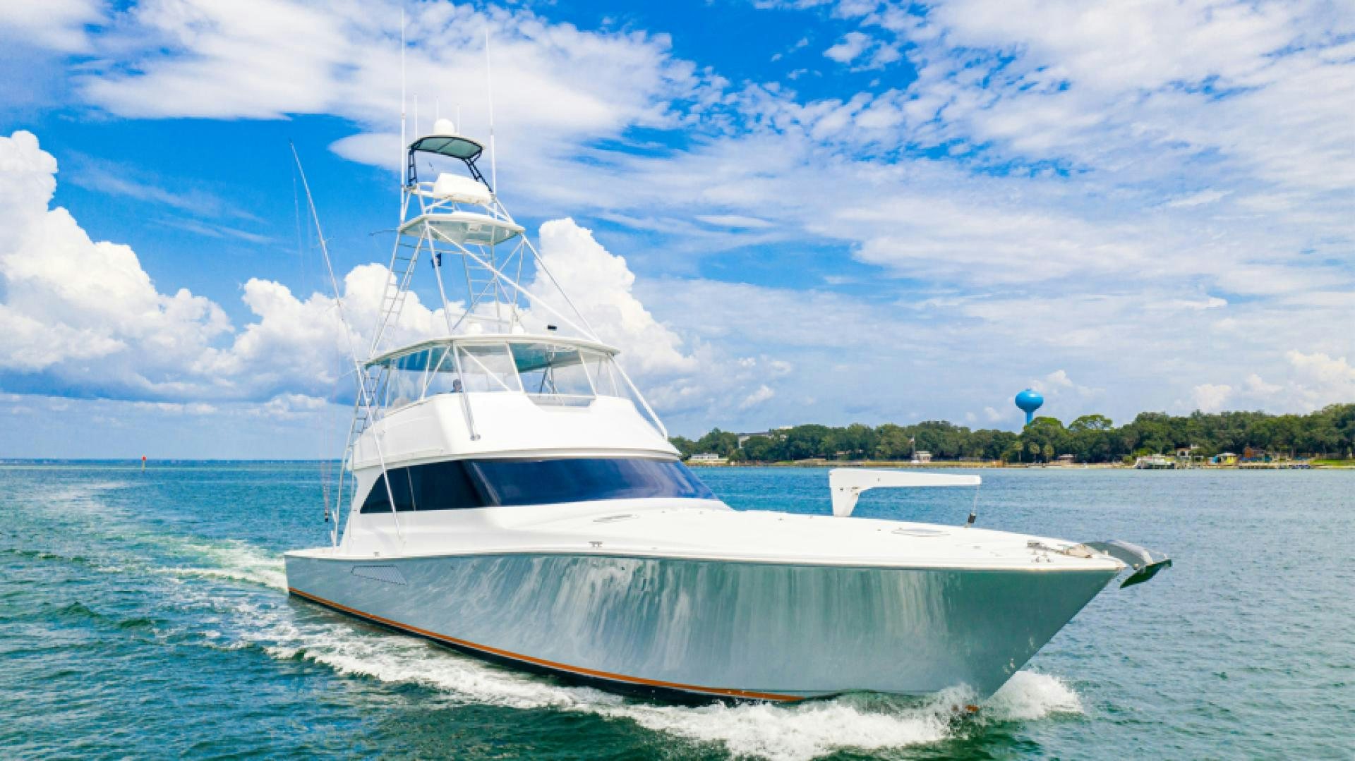 a white boat on the water aboard MISS PAULA V Yacht for Sale