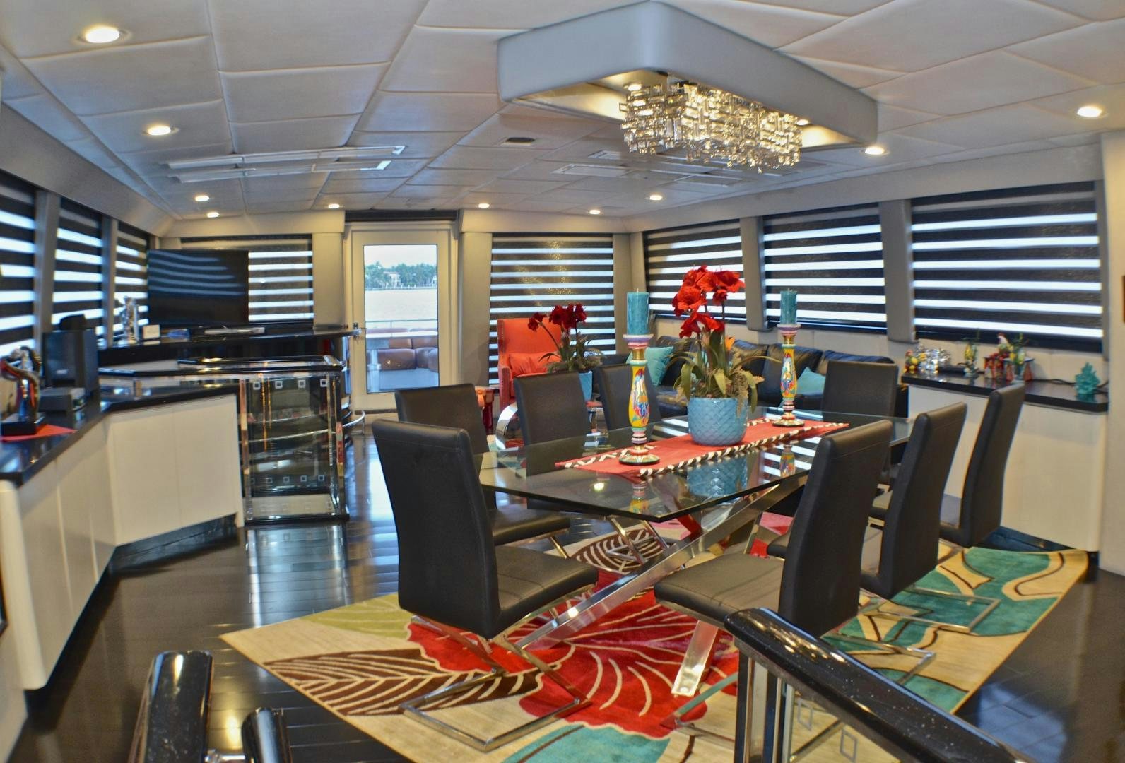 a large room with a table and chairs aboard AUDACITY Yacht for Sale