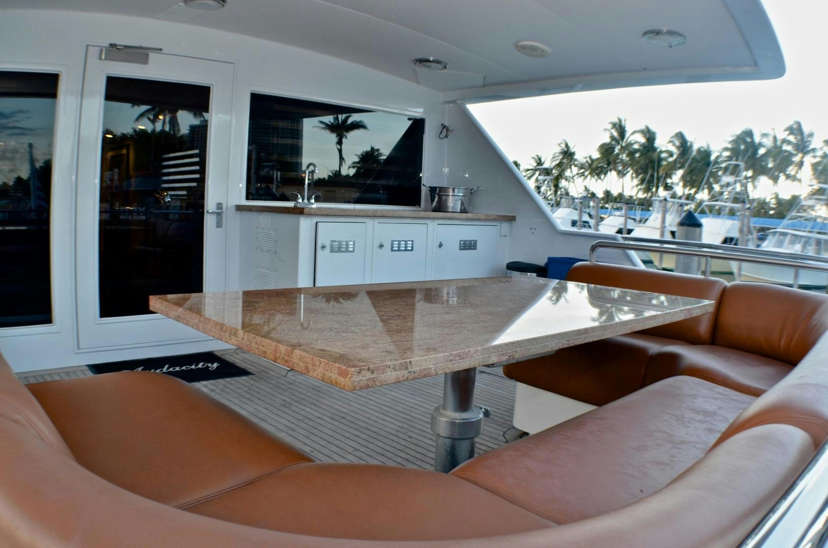 a room with a couch and a table aboard AUDACITY Yacht for Sale