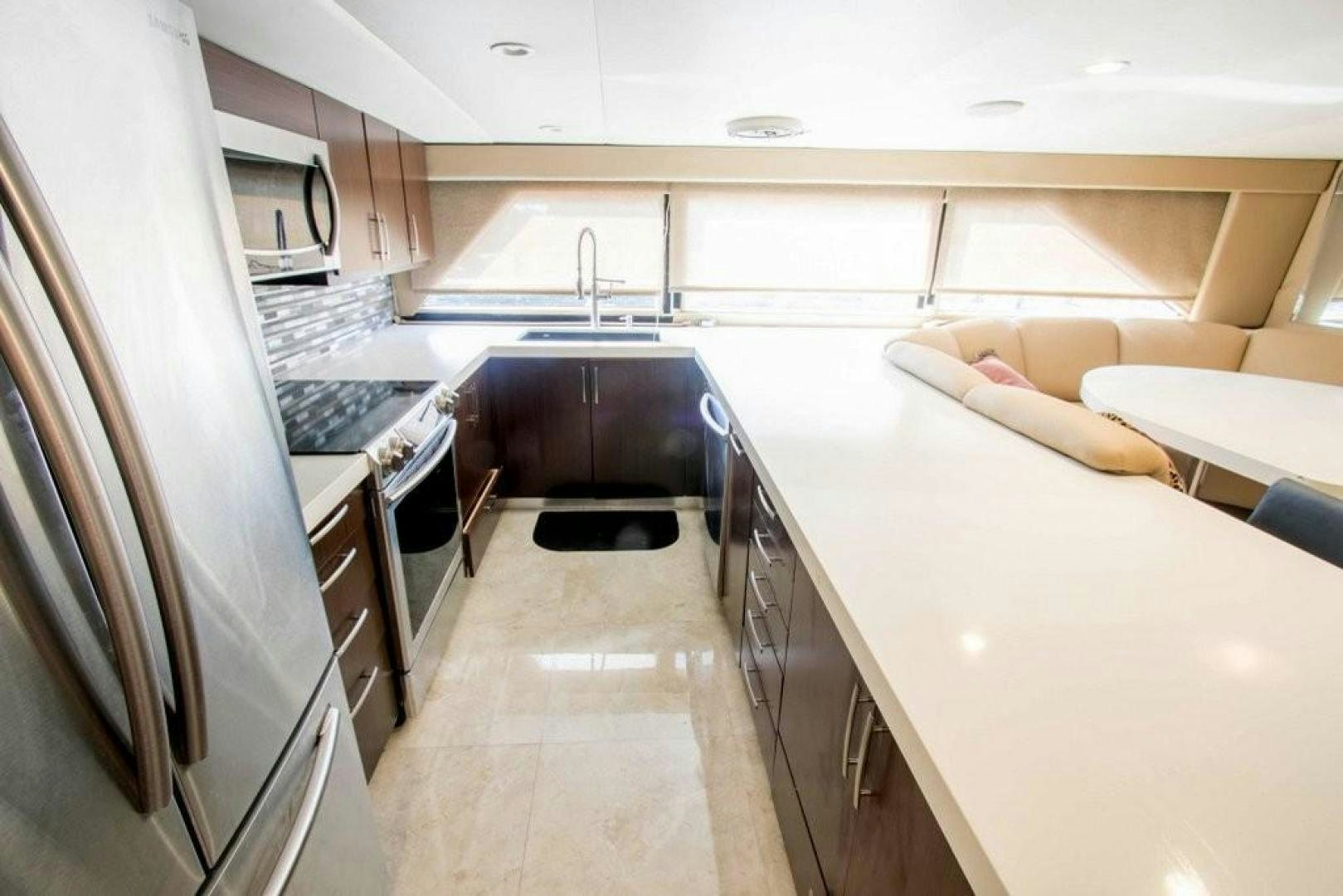 a kitchen with a large island aboard AUDACITY Yacht for Sale