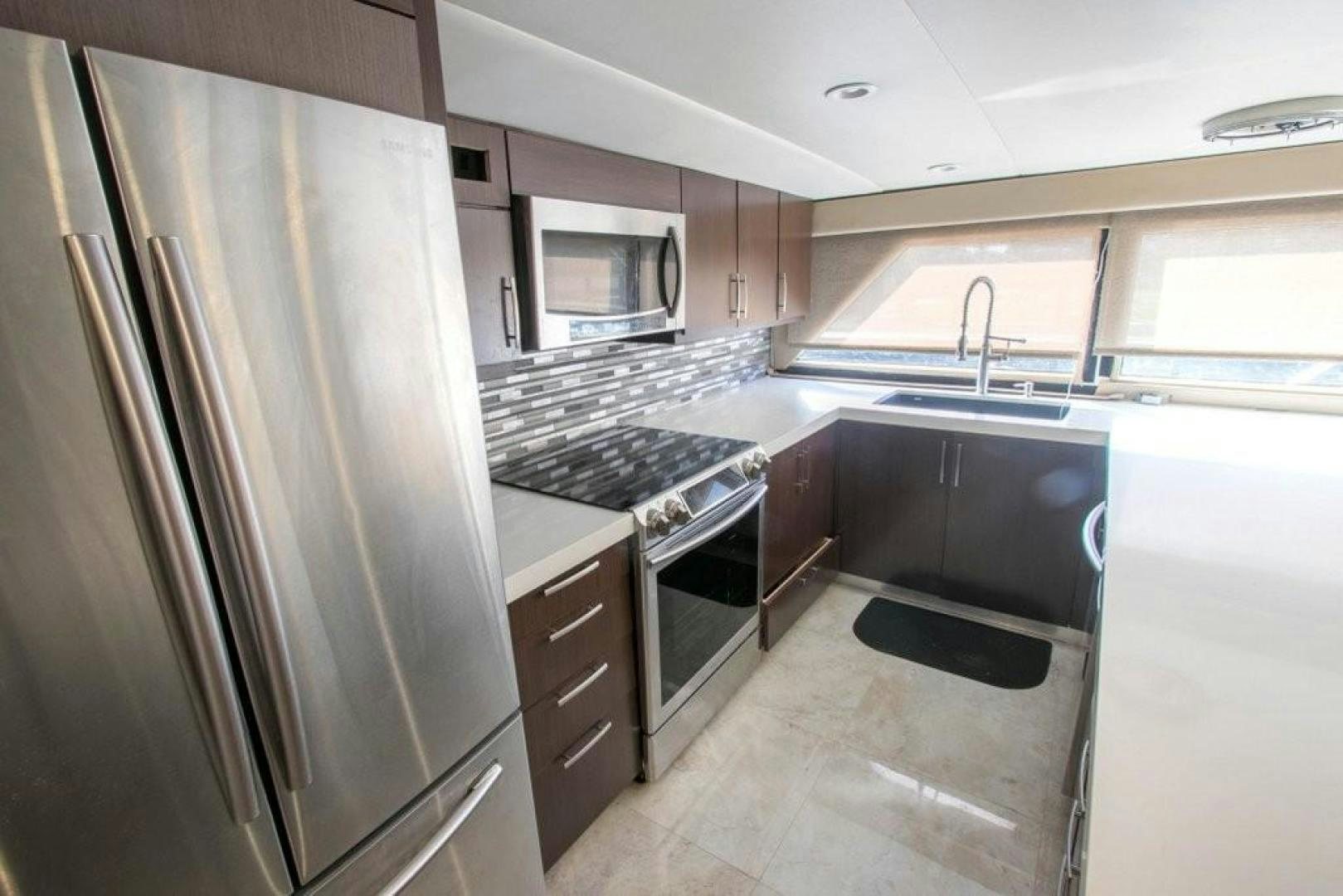 a kitchen with stainless steel appliances aboard AUDACITY Yacht for Sale