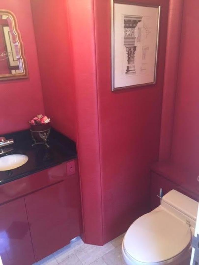 a bathroom with a sink and toilet aboard AUDACITY Yacht for Sale