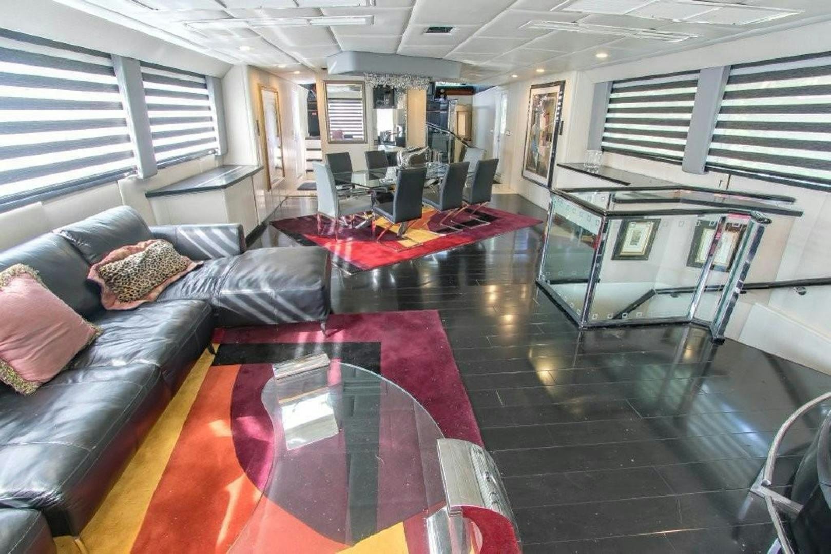 a living room with a couch and a table aboard AUDACITY Yacht for Sale