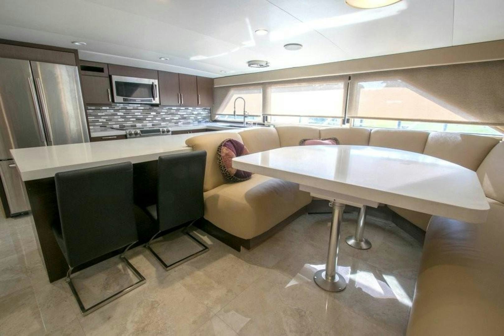 a living room with a couch and a table aboard AUDACITY Yacht for Sale