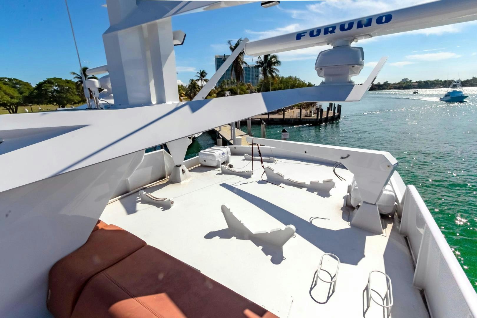 a hand holding a white boat aboard AUDACITY Yacht for Sale