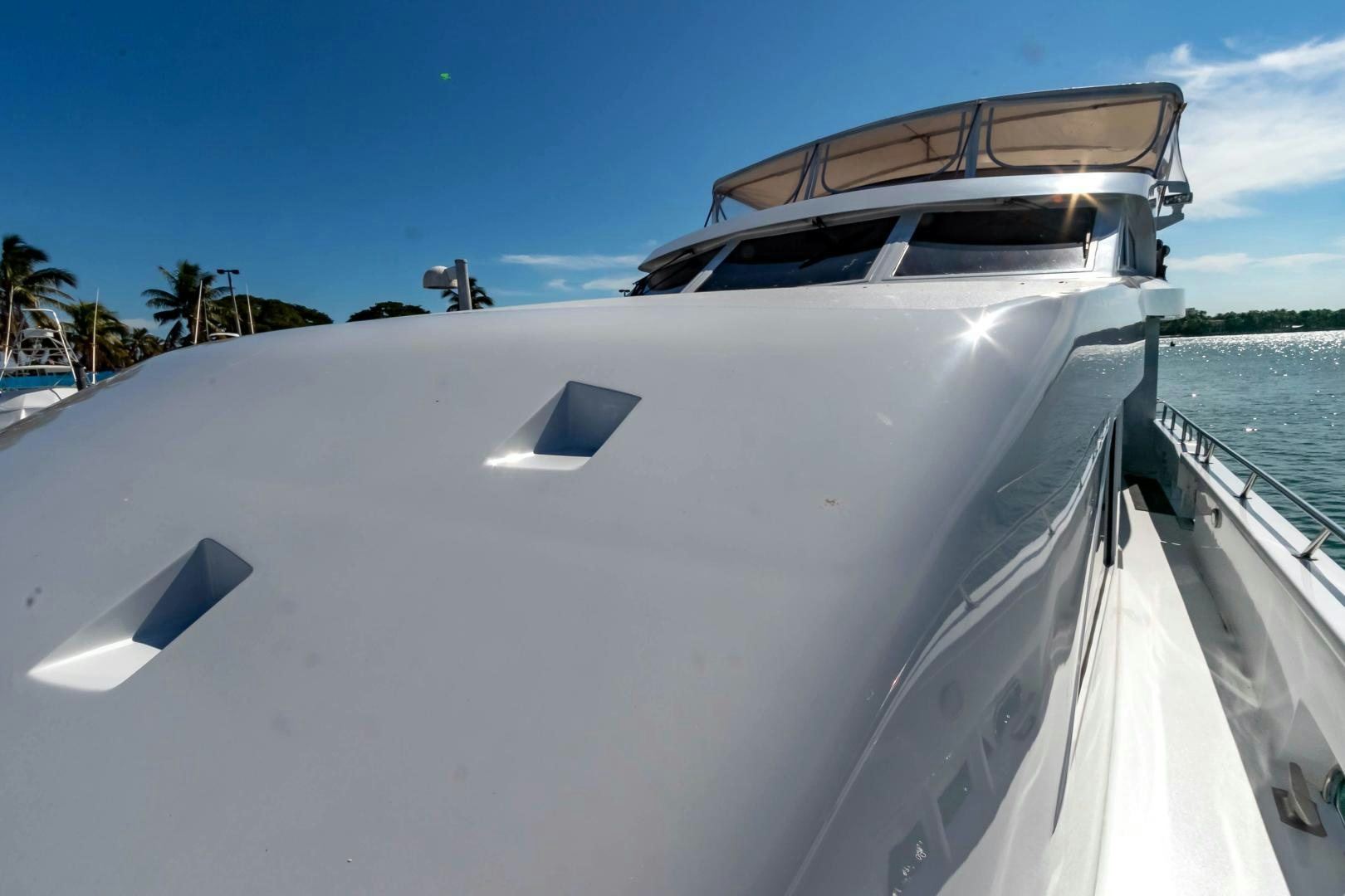 a white boat on a beach aboard AUDACITY Yacht for Sale