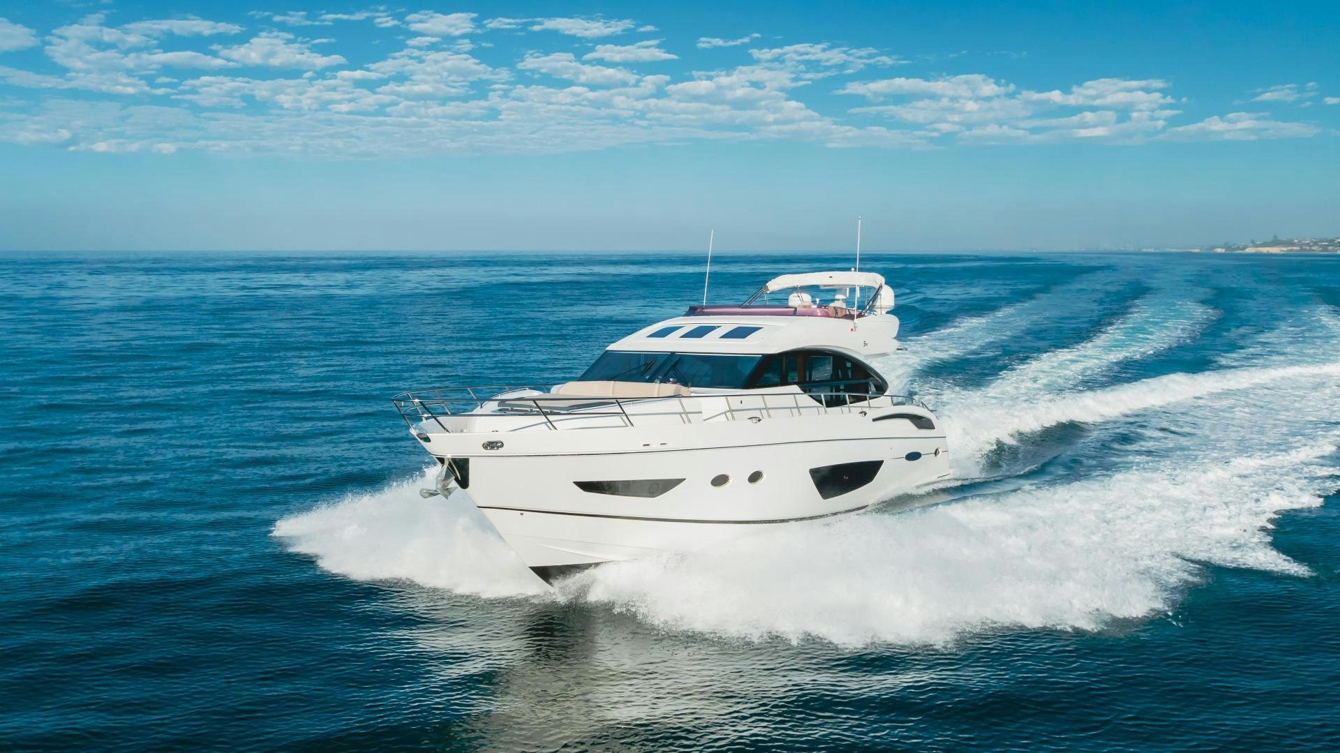 a white boat on the water aboard SEXSEA Yacht for Sale