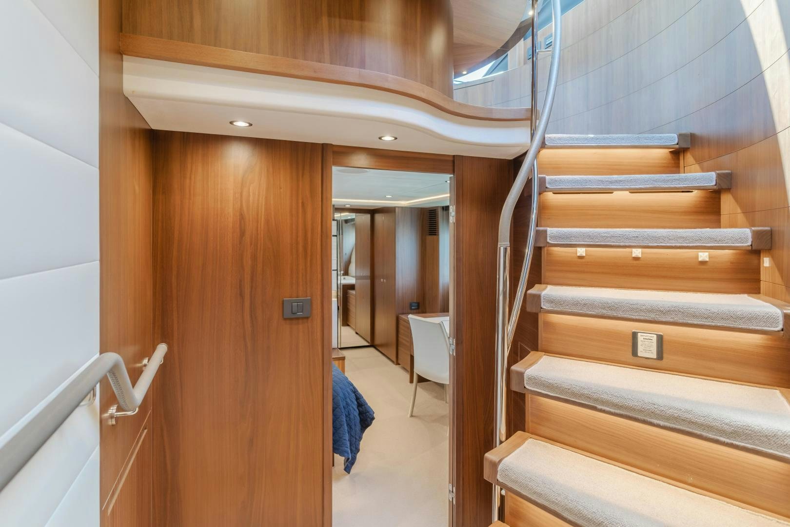 a room with wooden stairs aboard SEXSEA Yacht for Sale