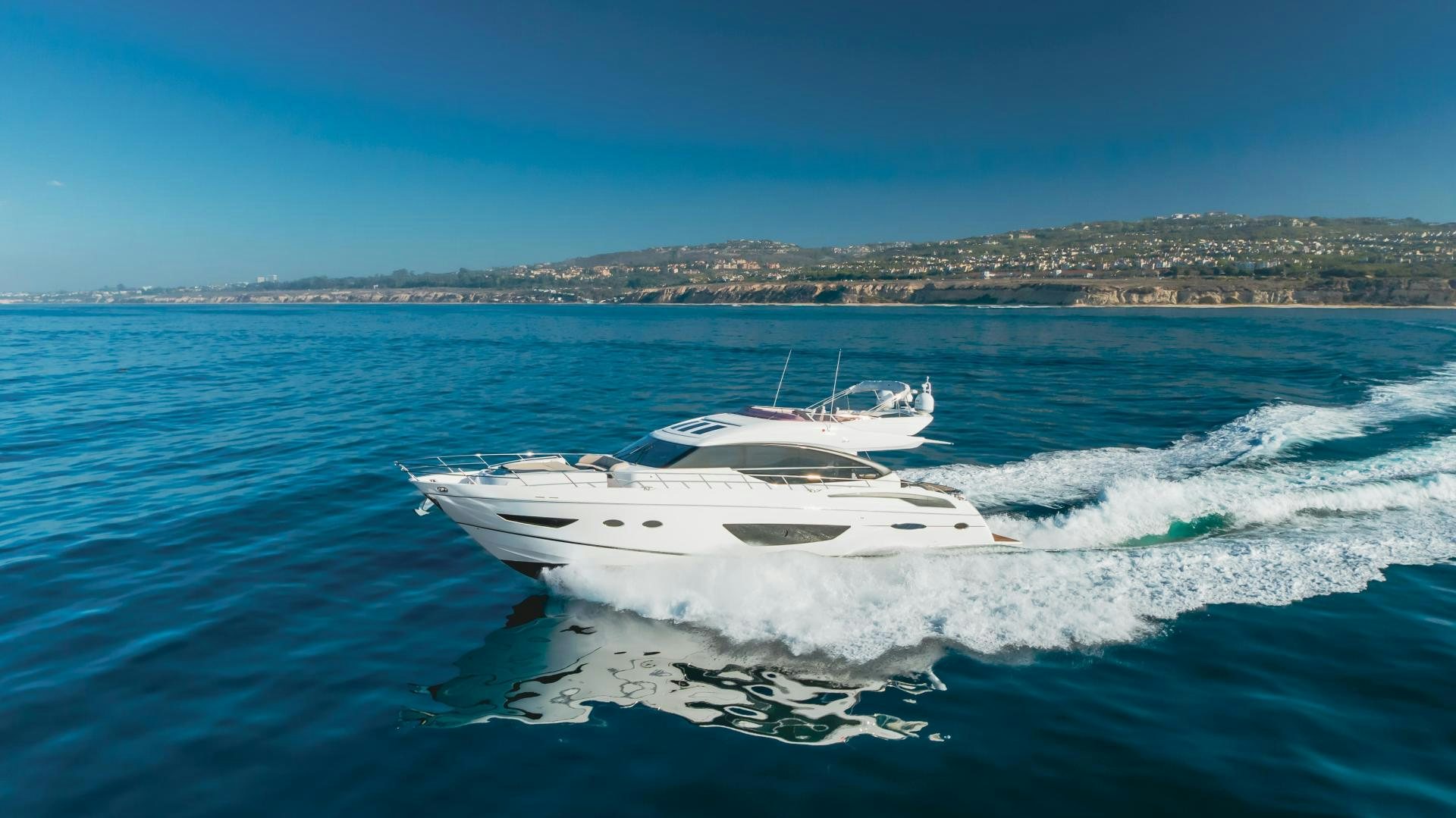 a white boat on the water aboard SEXSEA Yacht for Sale