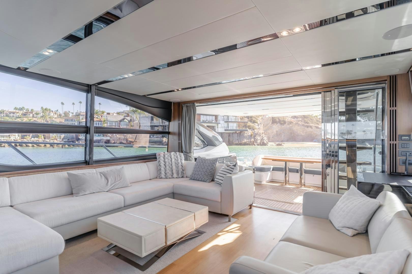 a living room with a large window aboard SEXSEA Yacht for Sale