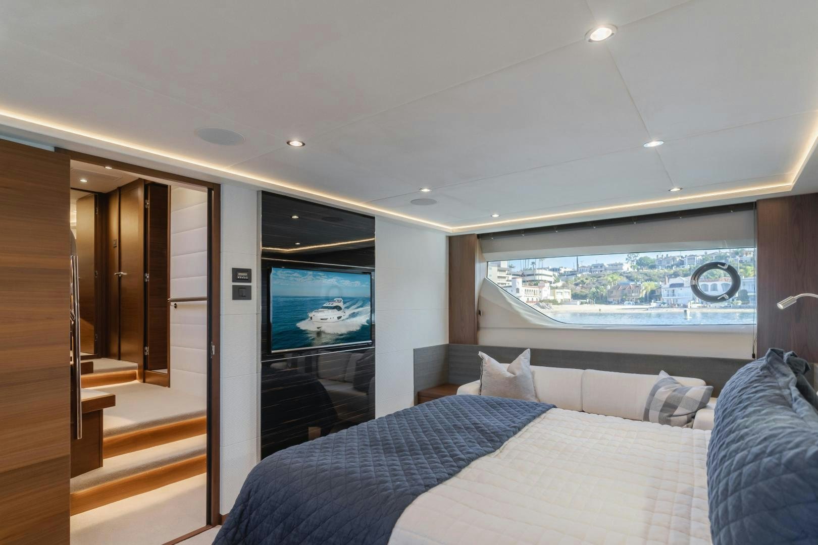 a bedroom with a large tv aboard SEXSEA Yacht for Sale