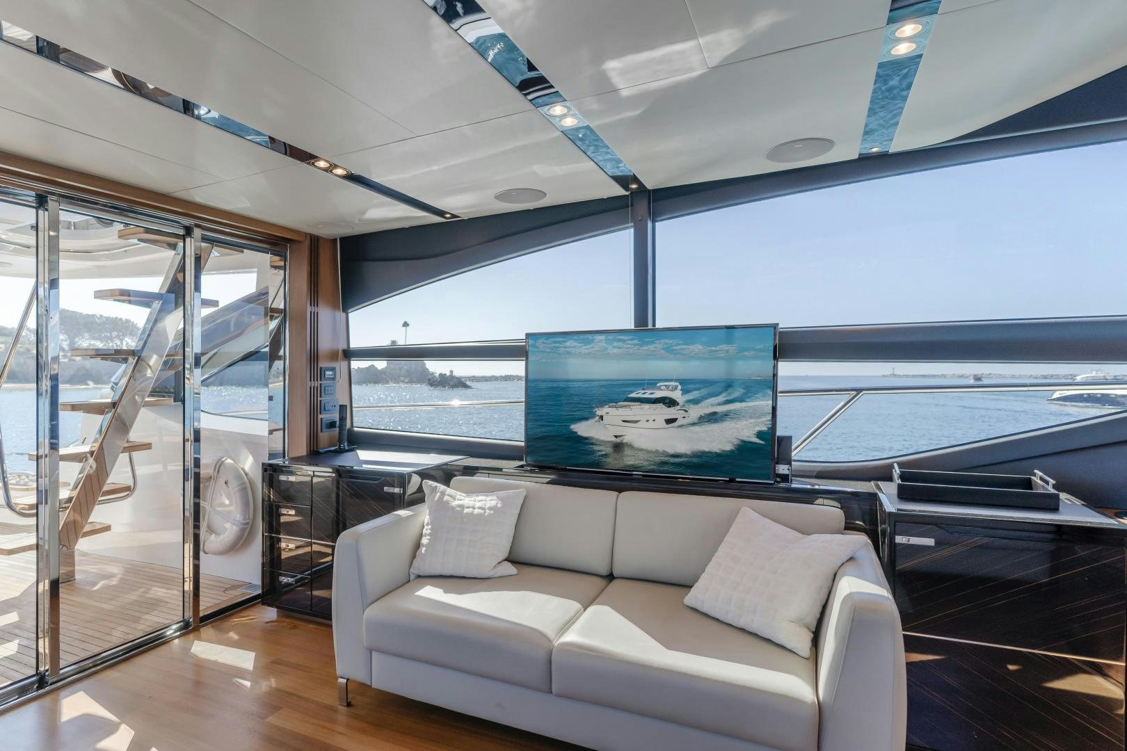 a living room with a large glass window aboard SEXSEA Yacht for Sale