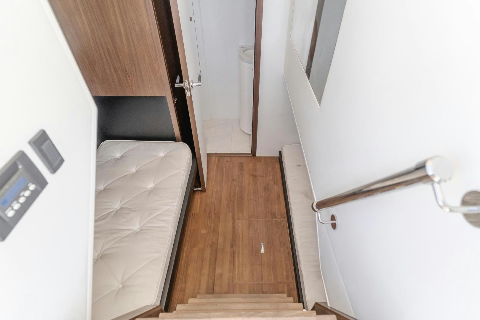 a room with a bed and a door aboard SEXSEA Yacht for Sale