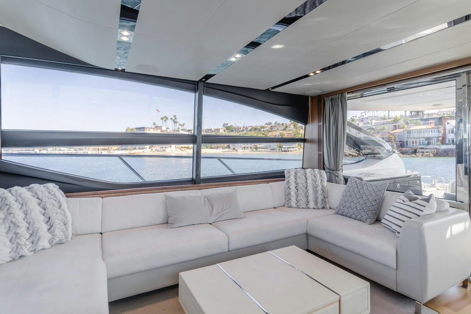 a living room with a large window aboard SEXSEA Yacht for Sale