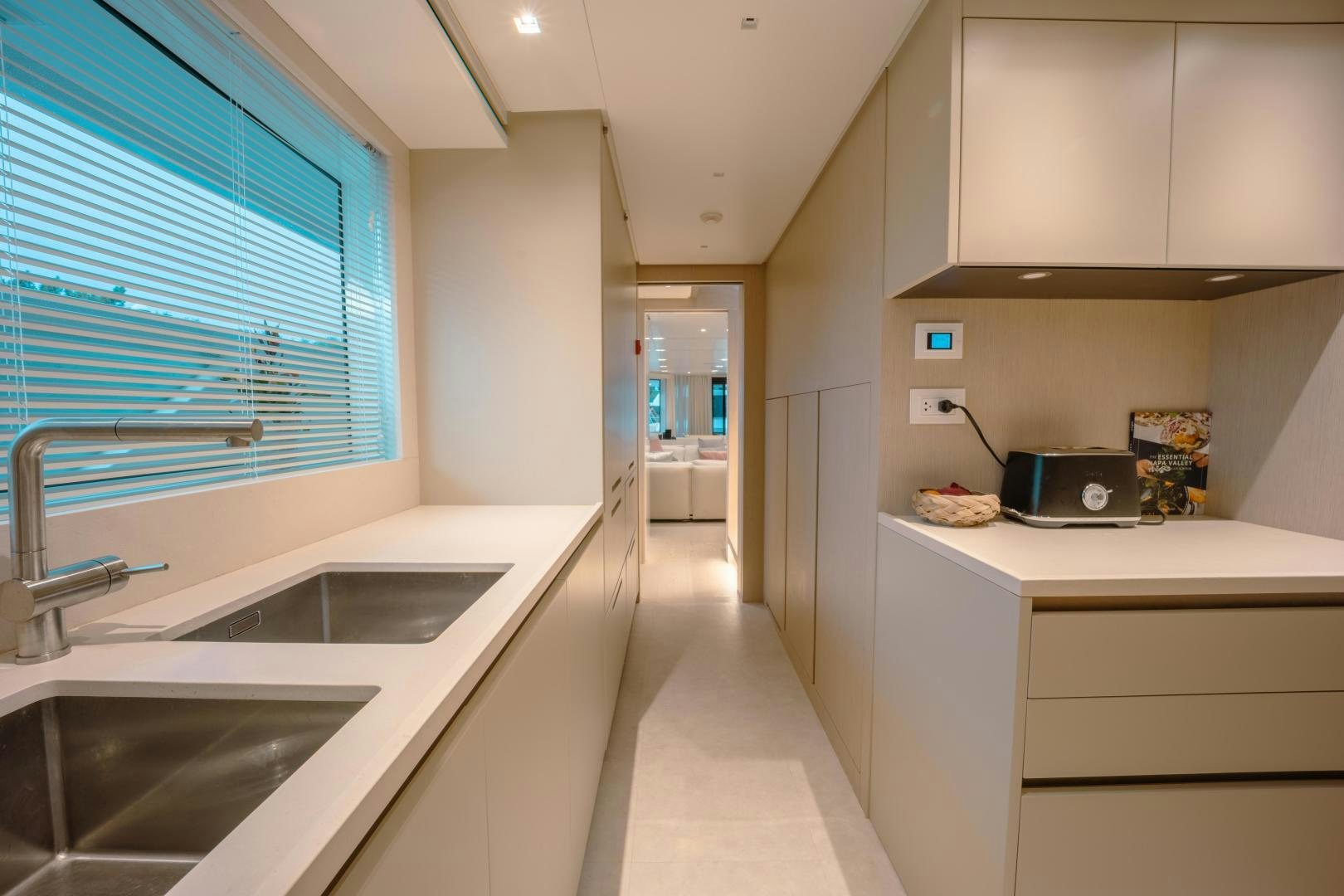 a kitchen with white cabinets aboard OUR ALEPH Yacht for Sale
