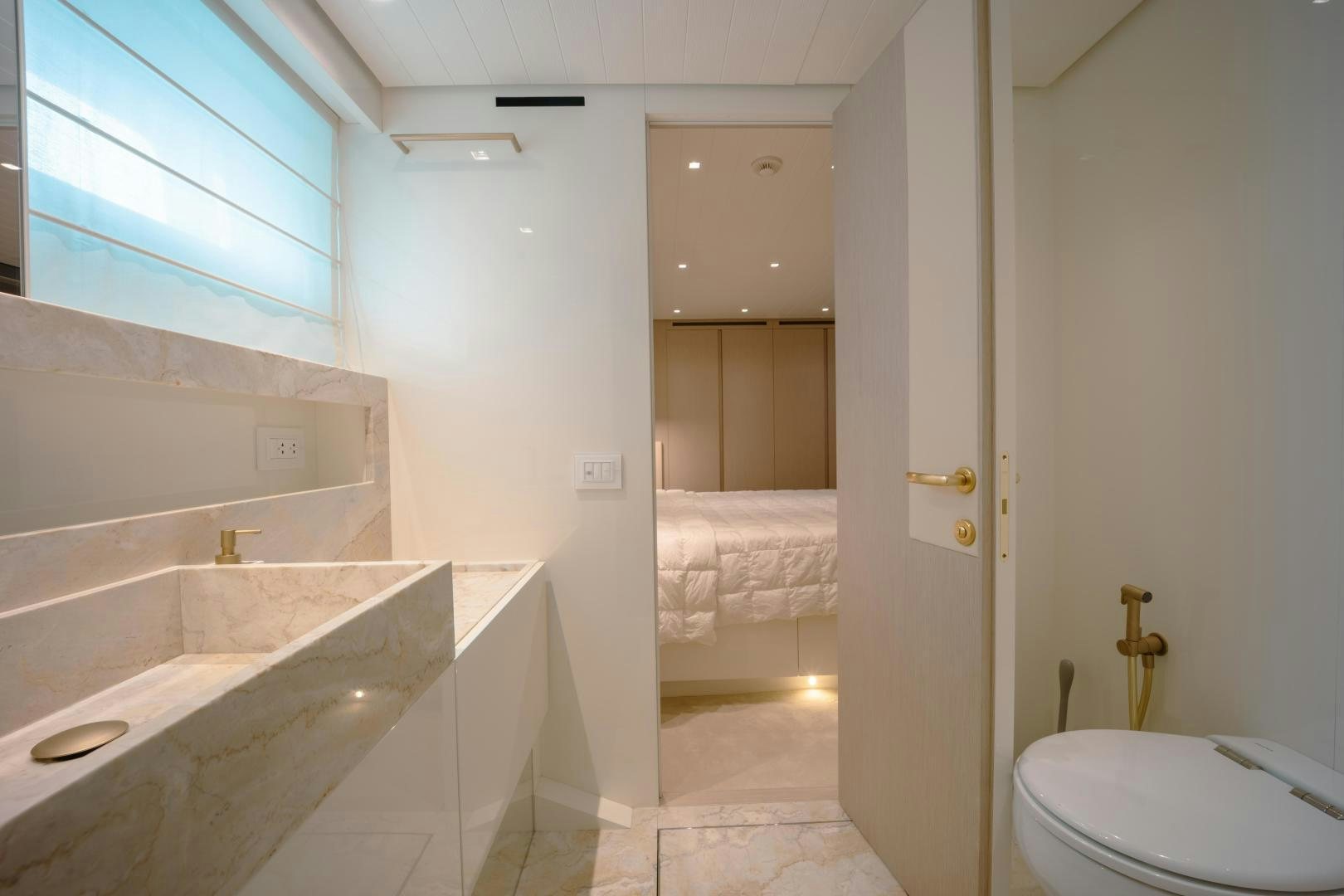 a bathroom with a tub sink and toilet aboard OUR ALEPH Yacht for Sale