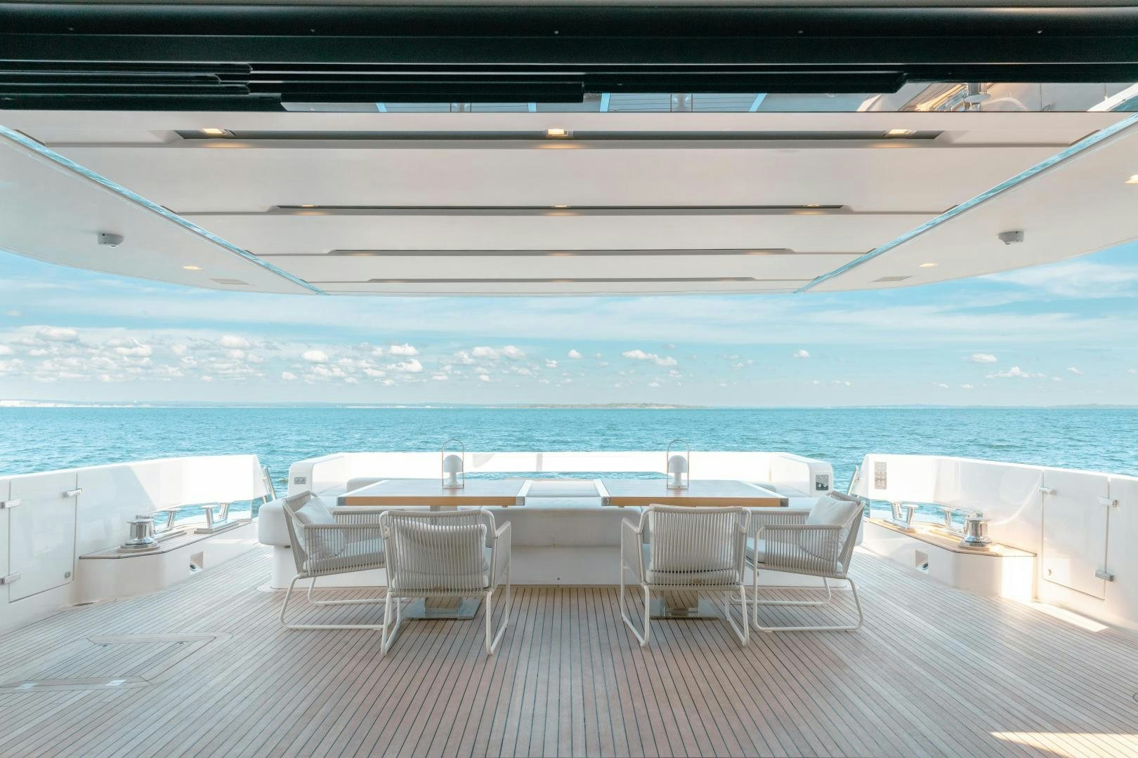 a pool with a deck and chairs aboard OUR ALEPH Yacht for Sale