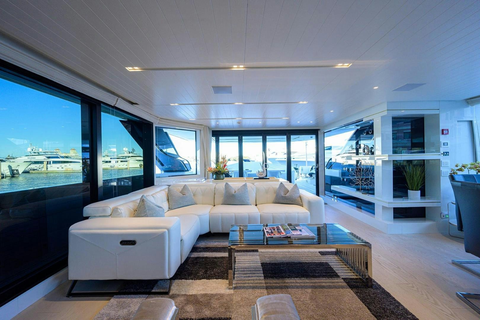 a living room with a large window aboard OUR ALEPH Yacht for Sale