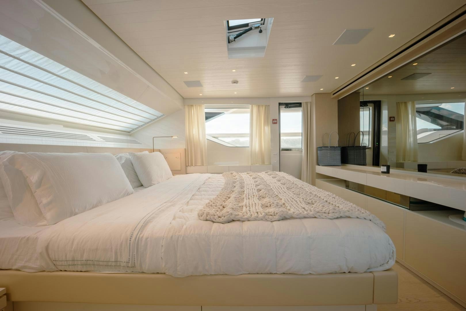 a large bed in a room aboard OUR ALEPH Yacht for Sale