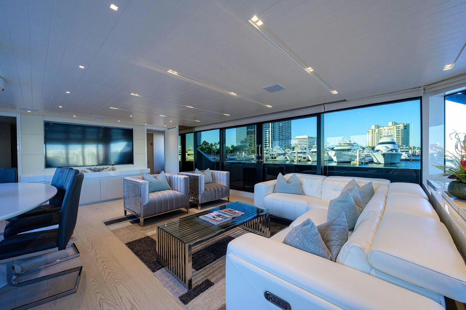 a living room with a large window aboard OUR ALEPH Yacht for Sale