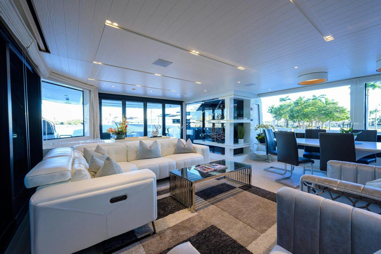 a living room with a large window aboard OUR ALEPH Yacht for Sale