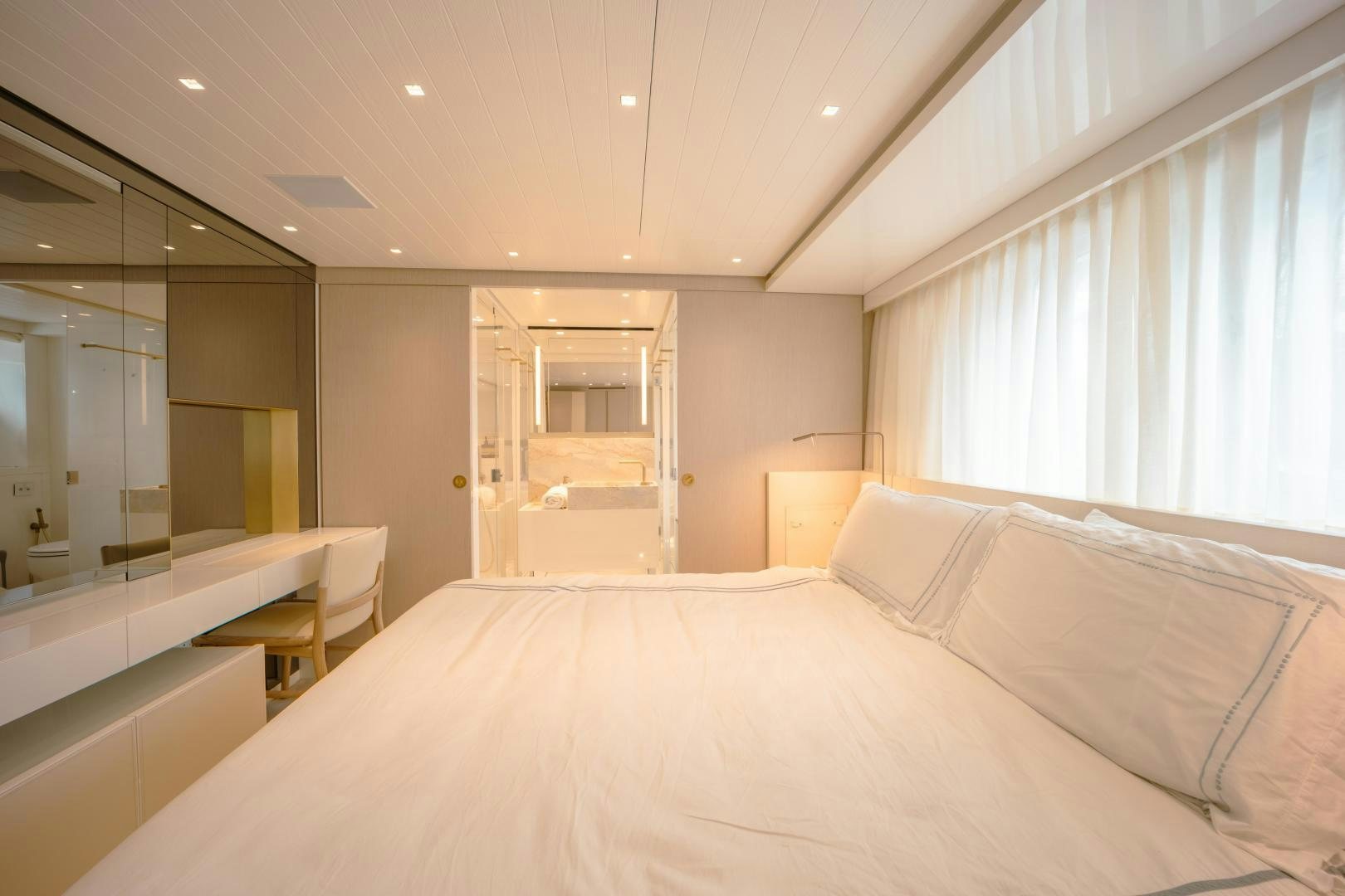 a large bed in a hotel room aboard OUR ALEPH Yacht for Sale