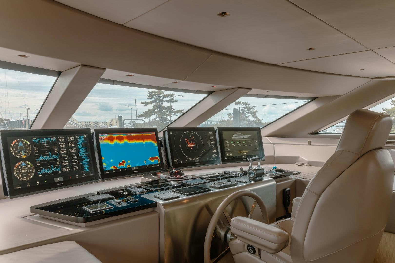 a room with many monitors and a chair aboard OUR ALEPH Yacht for Sale