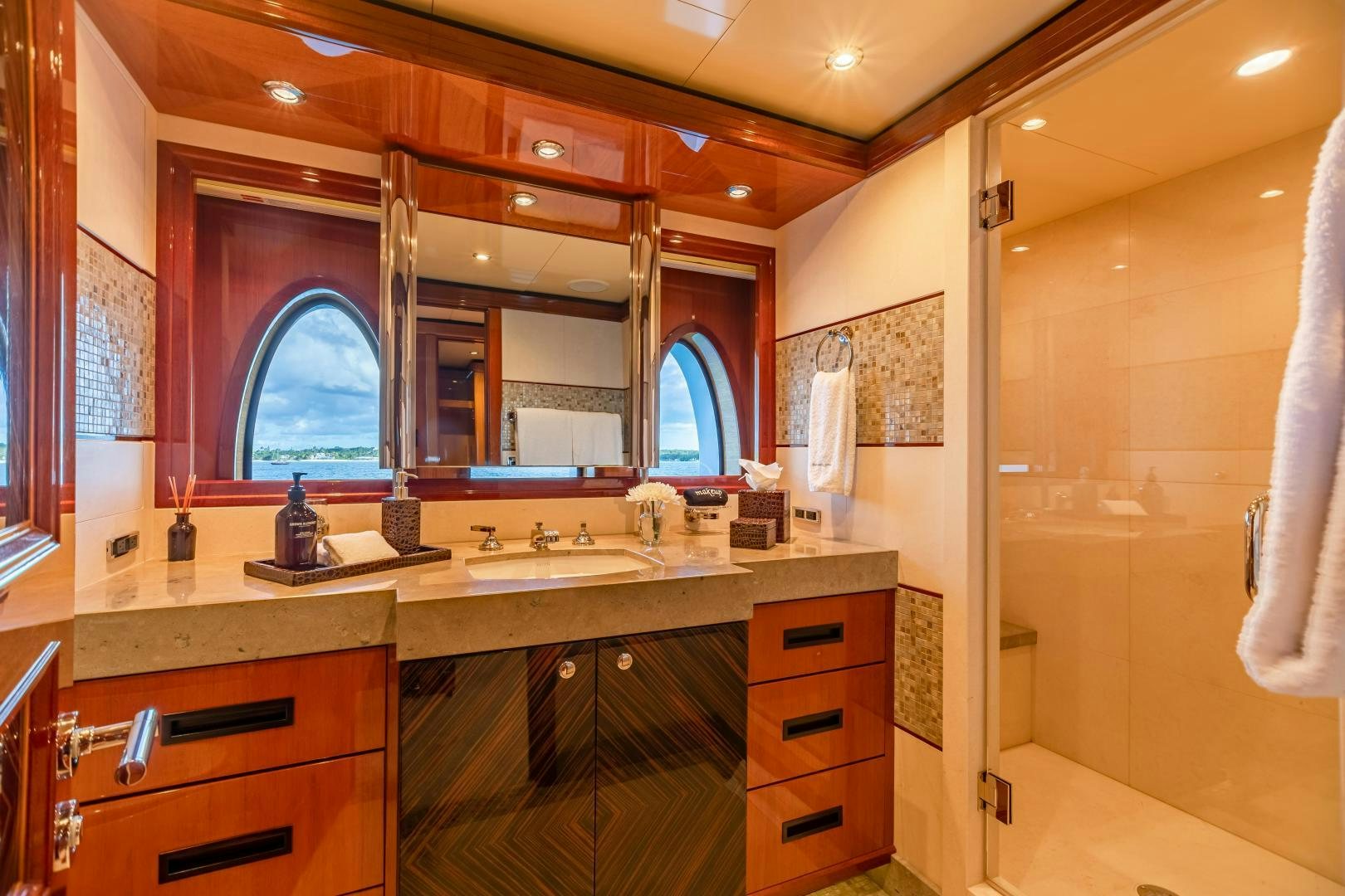 a bathroom with a sink and cabinets aboard IMPROMPTU Yacht for Sale