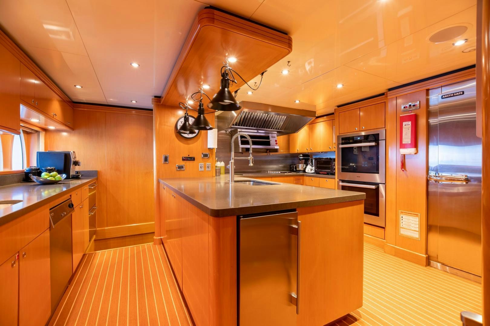 a kitchen with a large island aboard IMPROMPTU Yacht for Sale