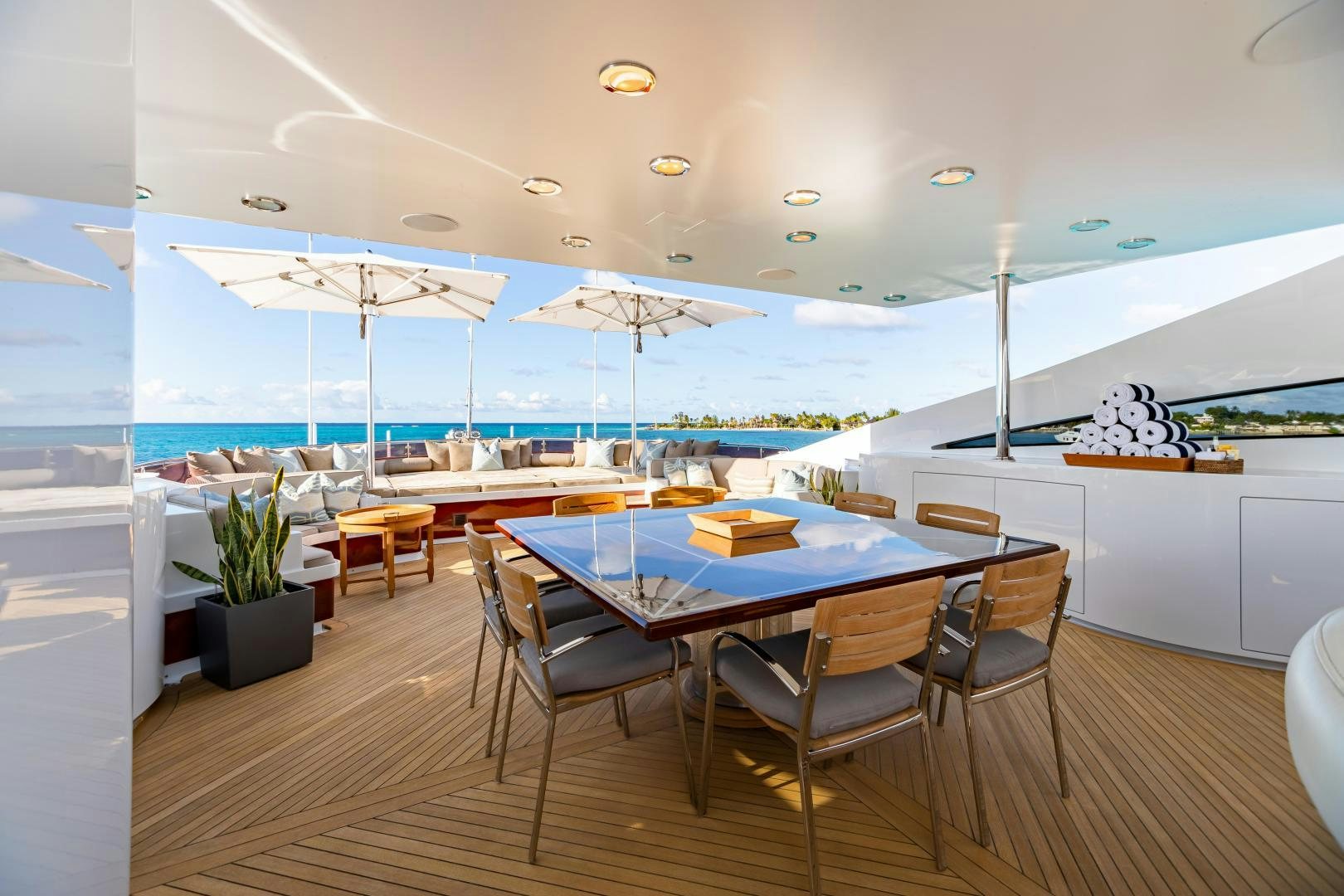 a room with a table and chairs aboard IMPROMPTU Yacht for Sale