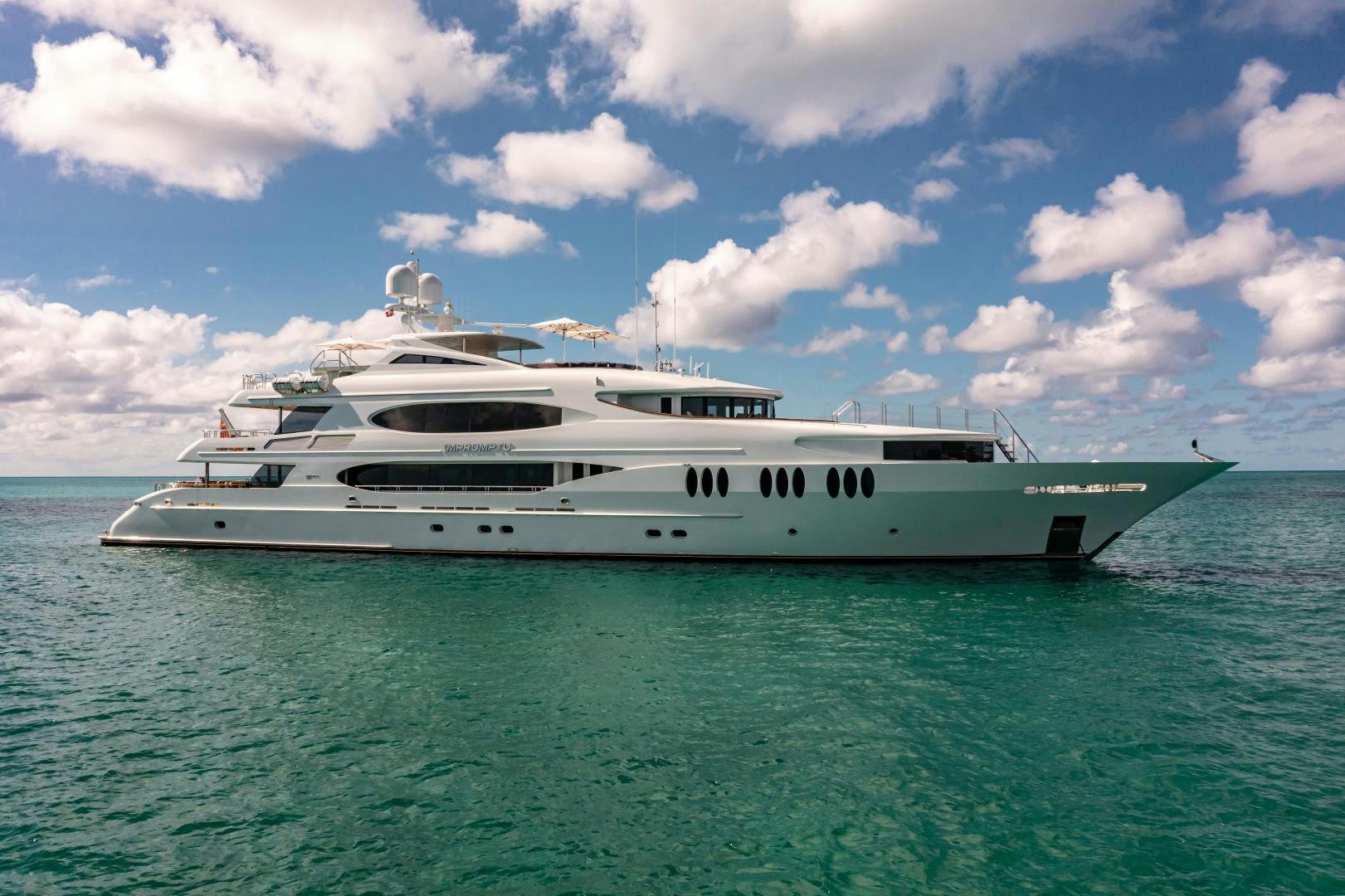 a white yacht in the water aboard IMPROMPTU Yacht for Sale