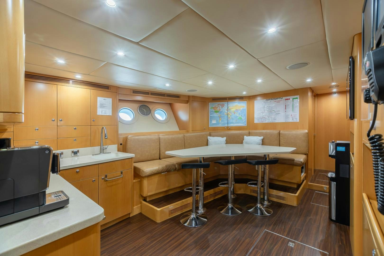 a room with a couch and a table aboard IMPROMPTU Yacht for Sale