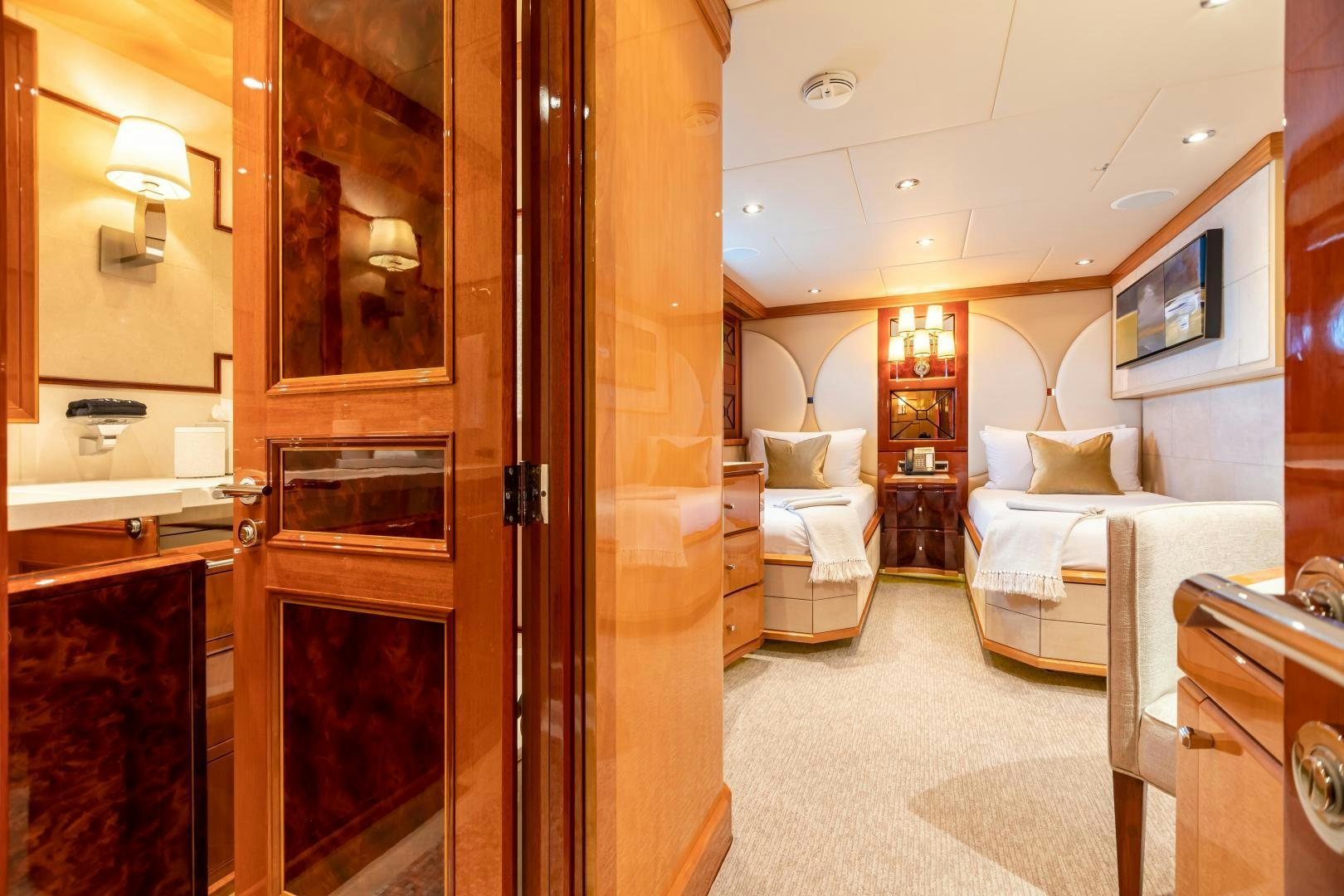 a room with a bed and a mirror aboard IMPROMPTU Yacht for Sale