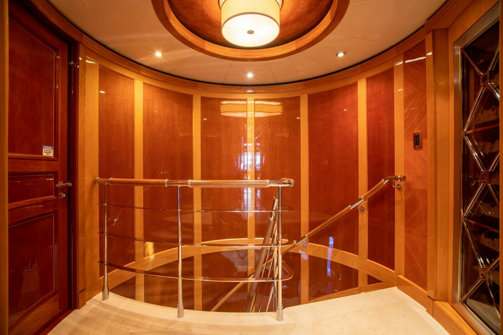 a glass door with a glass wall aboard IMPROMPTU Yacht for Charter