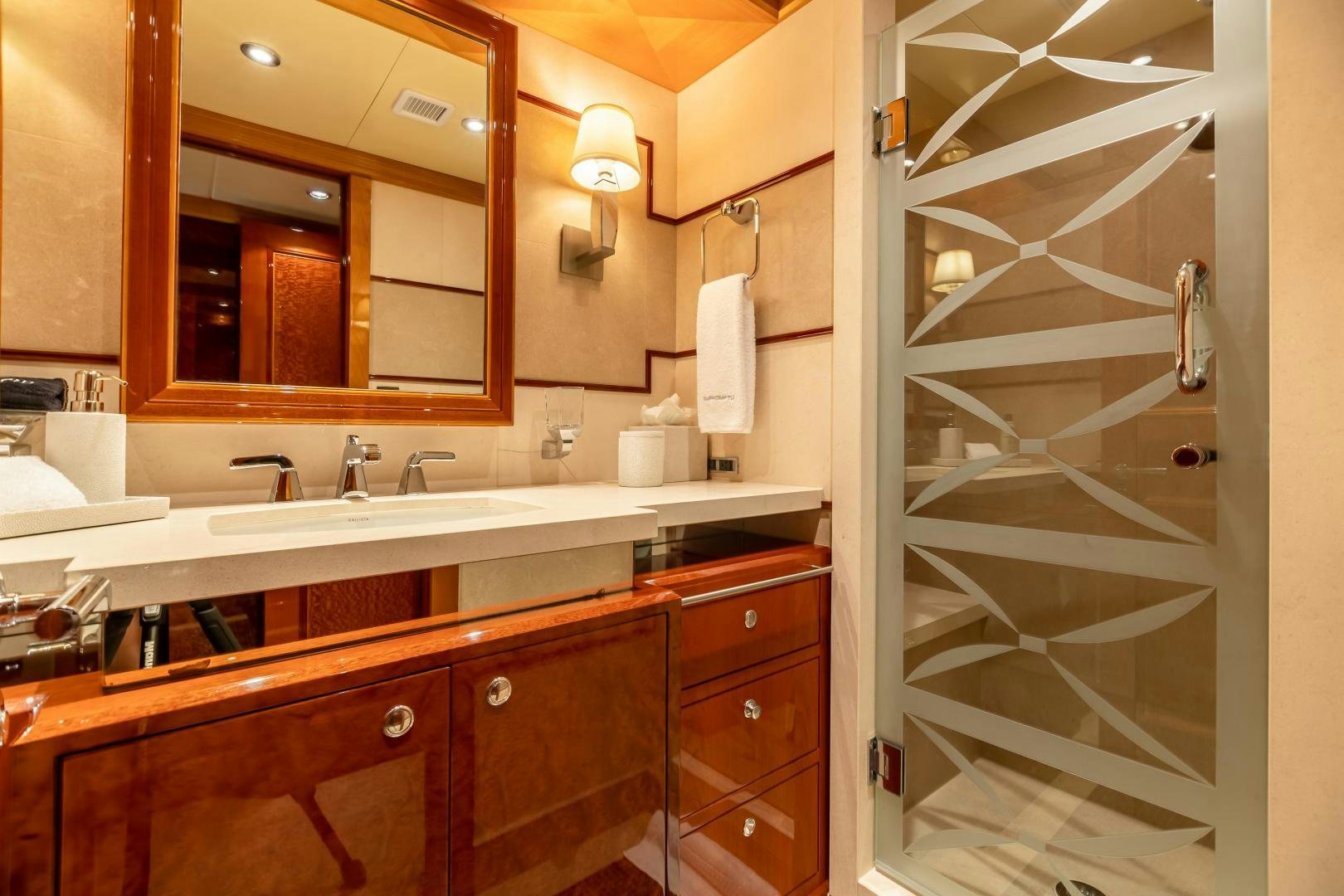 a bathroom with a glass shower aboard IMPROMPTU Yacht for Sale